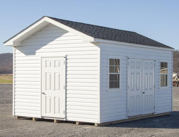 Custom Front Entry Peak Shed with White Vinyl Siding from Pine Creek Structures