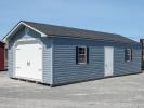 14x32 Peak Single-Car Garage With Twilight Blue Vinyl Siding, White Overhead Door, Black Shutters, and Shingle Roof